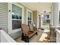 Charming front porch seating area with stylish decor and plants at 1437 Imperial Ct, York, SC 29745
