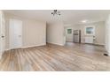 Open-concept living area with sleek floors, neutral paint, and a modern aesthetic at 16 Green St, York, SC 29745