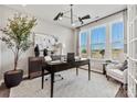 Modern home office with large window, stylish light fixture, and contemporary decor at 162 Nicholson Ln, Mooresville, NC 28115