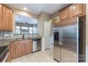 Updated kitchen features stainless steel appliances, granite countertops and breakfast bar at 165 N Arcadian Way, Mooresville, NC 28117
