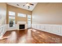 Bright and airy living room with high ceilings, fireplace, and hardwood floors at 165 N Arcadian Way, Mooresville, NC 28117