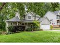 Traditional two-story home with landscaped front yard and an attached garage at 17318 Cambridge Grove Dr, Huntersville, NC 28078