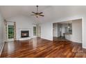 Spacious living room features hardwood floors, a fireplace, and lots of natural light at 17318 Cambridge Grove Dr, Huntersville, NC 28078