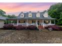Charming home featuring a covered front porch, dormer windows and a beautiful stone driveway at 2451 Reepsville Rd, Lincolnton, NC 28092