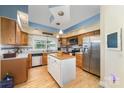 Traditional kitchen features a center island, stainless steel appliances and hardwood flooring at 2451 Reepsville Rd, Lincolnton, NC 28092