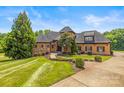 Beautiful single-Gathering home with lush landscaping and a well-manicured front yard at 270 Sandhills Ct, Mooresville, NC 28115