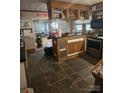 Kitchen area with custom built in bar, and stainless steel oven at 29386 Nelson Mountain Rd, Albemarle, NC 28001