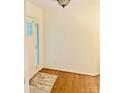 A bright entryway with hardwood floors and a neutral-toned rug at 312 Shady Ln, Lincolnton, NC 28092