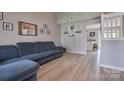 Bright living room with hard floors and views of the open-concept kitchen and dining area at 327 Wilkes Place Dr, Fort Mill, SC 29715