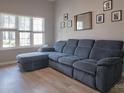 Comfortable living room featuring a large, plush sectional sofa and bright natural light at 327 Wilkes Place Dr, Fort Mill, SC 29715