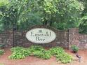Stone sign for Emerald Bay community framed by trees and landscaping at 408 Emerald Bay Dr, Salisbury, NC 28146