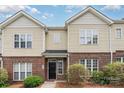 Charming townhome featuring a brick and vinyl exterior with well-maintained landscaping at 4368 Yoruk Forest Ln, Charlotte, NC 28211