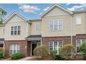 Charming townhome featuring a brick and vinyl exterior with well-maintained landscaping at 4368 Yoruk Forest Ln, Charlotte, NC 28211