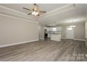 Bright, open living space featuring modern flooring and a seamless flow to the kitchen at 507 E Cloninger St, Dallas, NC 28034