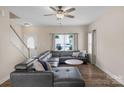 Inviting living room featuring hardwood floors, a leather sectional sofa, and plenty of natural light at 507 Galesburg Dr, Monroe, NC 28110