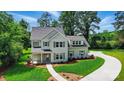 Stunning exterior view of the two-story home showcasing manicured lawn and landscaping at 9315 Simpson Rd, Waxhaw, NC 28173