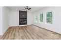 Bright living room with fireplace, hardwood floors, recessed lighting, and natural light from many windows at 1011 Sandy Ct, Gastonia, NC 28056