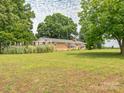 Spacious brick home with a big yard, mature trees, and ample outdoor space at 1325 Marshville Olive Branch Rd, Marshville, NC 28103