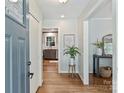 Bright foyer featuring hardwood floors, fresh paint, and access to the kitchen at 1522 Barberry Ct, Charlotte, NC 28211