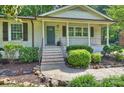 Inviting front porch with brick steps, decorative railing, and charming architectural details at 1522 Barberry Ct, Charlotte, NC 28211