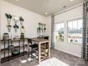 Bright flex room featuring natural light, plush carpet, and versatile decor for a home office or hobby space at 1600 Baymont Ct, Stanley, NC 28164