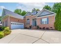 Beautiful brick home featuring an attached two car garage at 1643 Essex Hall Dr, Rock Hill, SC 29730