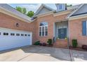Close up of brick home featuring attached two car garage at 1643 Essex Hall Dr, Rock Hill, SC 29730