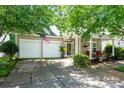 Charming home boasting a two-car garage and inviting covered front porch with cozy seating at 19539 Denae Lynn Dr, Cornelius, NC 28031