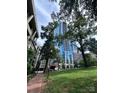 Modern high rise building with stunning blue glass exterior at 210 N Church St, Charlotte, NC 28202