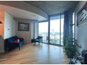 Bright open concept living room with balcony and stunning city view at 210 N Church St, Charlotte, NC 28202