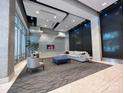 Modern lobby with sleek decor and a calming water feature at 210 N Church St, Charlotte, NC 28202