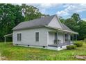 Exterior shot of a quaint house with a covered porch and green grass at 2126 Robby Dr, Maiden, NC 28650