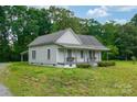 Quaint single-story home with a covered porch and a large, grassy yard at 2126 Robby Dr, Maiden, NC 28650