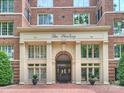 A close-up shot showcases the elegant doorway of 'The Sterling' with its striking architectural details at 2445 Selwyn Ave # 104, Charlotte, NC 28209