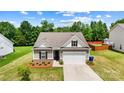 Beautiful single-Gathering home with a well-maintained lawn and landscaping, showcasing curb appeal on a sunny day at 2928 Parkwest Dr, Albemarle, NC 28001