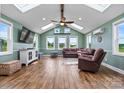 Inviting living room featuring a vaulted ceiling, skylights, hardwood floors, and comfortable seating at 3645 Kimber Ln, Sherrills Ford, NC 28673