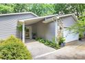 Welcoming covered front entrance with stone accents and well-maintained walkway at 3708 Sweetgrass Ln, Charlotte, NC 28226