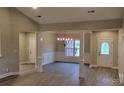 Spacious dining room with wainscoting, a chandelier, and natural light at 3712 Travertine Dr, Lancaster, SC 29720