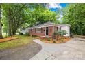 Beautifully maintained brick home with a landscaped yard and classic design at 4114 Stacy Blvd, Charlotte, NC 28209