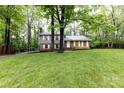 Well-maintained two-story house with a lush green lawn and mature trees, creating a serene and inviting atmosphere at 509 Selkirk Pl, Charlotte, NC 28270