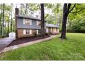 Attractive two-story home with brick and siding, complemented by a well-maintained lawn and landscaping at 509 Selkirk Pl, Charlotte, NC 28270
