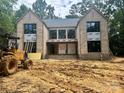 Exterior of the home under construction, showcasing the brick facade and window placements at 5427 Addison Dr, Charlotte, NC 28211