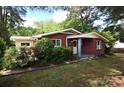 Well-maintained brick home with lush greenery and a cozy entrance showcasing a serene setting at 709 Sunset Dr, Salisbury, NC 28147