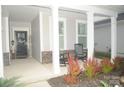 Inviting covered front porch with rocking chairs and decorative plants, a cozy spot to relax outdoors at 813 Latrobe Dr # 365, Iron Station, NC 28080