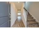 Inviting foyer features wood flooring and a staircase to the upper level at 815 Blue Canyon Dr, York, SC 29745