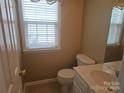 Powder room with updated vanity and fixtures at 9237 Bellegarde Dr, Charlotte, NC 28277
