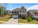 Charming two-story house with a classic design and a neatly landscaped yard at 1001 Linn Cv, Waxhaw, NC 28173