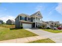 Beautiful two-story home featuring a spacious driveway and attractive curb appeal at 1001 Linn Cv, Waxhaw, NC 28173