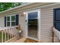 Close-up of front door, deck, house number and welcome mat at 105 Peridot Dr, Statesville, NC 28625
