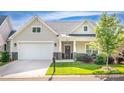 Charming home with a two-car garage, well-manicured lawn, and covered front entry to increase curb appeal at 1109 Bunch Dr, Statesville, NC 28677